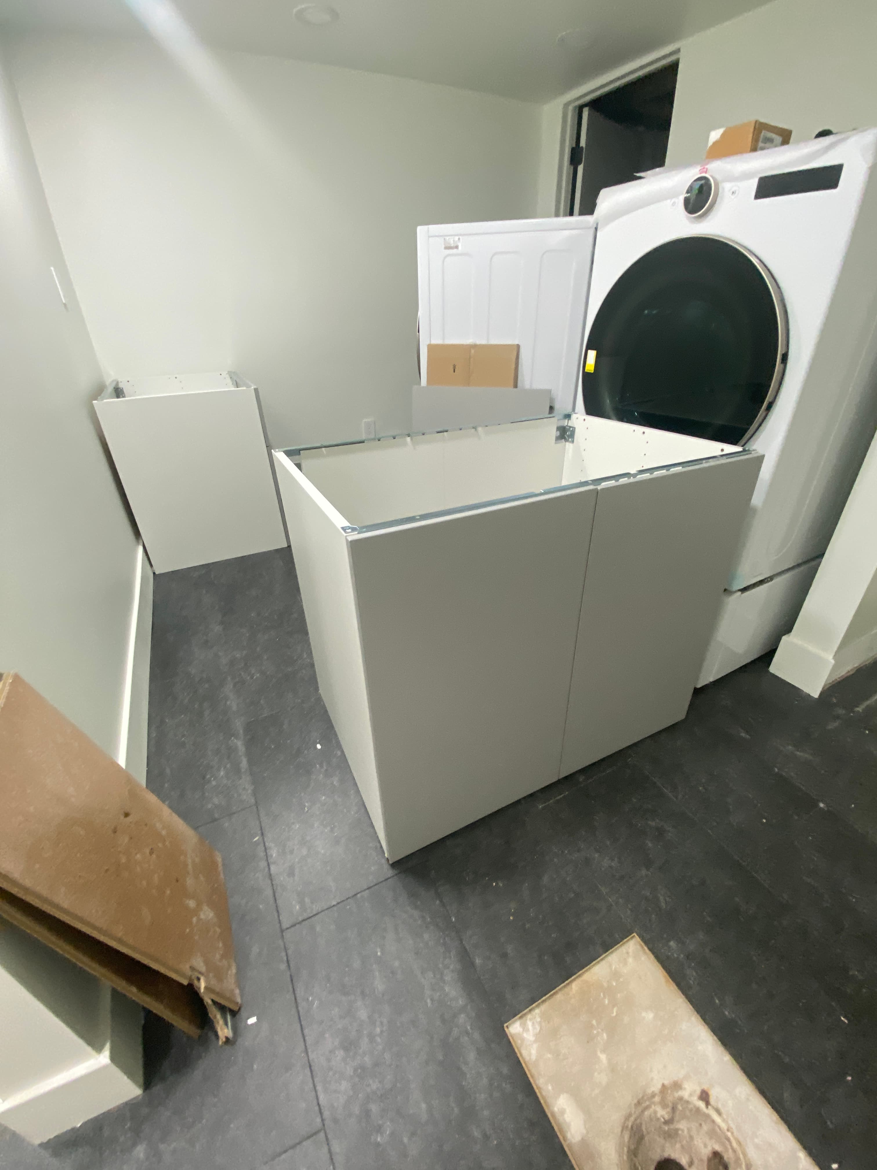 laundry room installation in progress, view 1